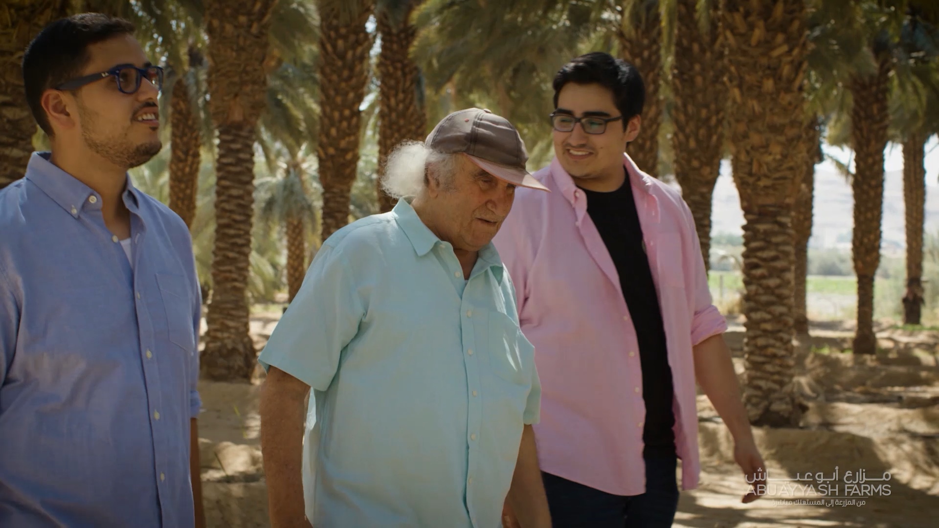 Mahmoud Abu Ayyash with his two sons at the family farm